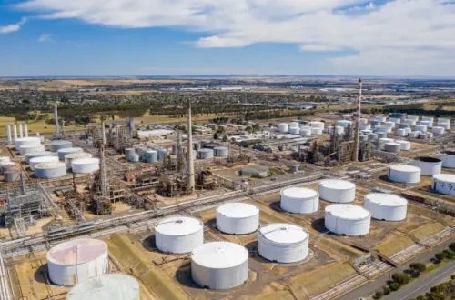 Aerial photo of storage tanks and production facilities of an oil refinery